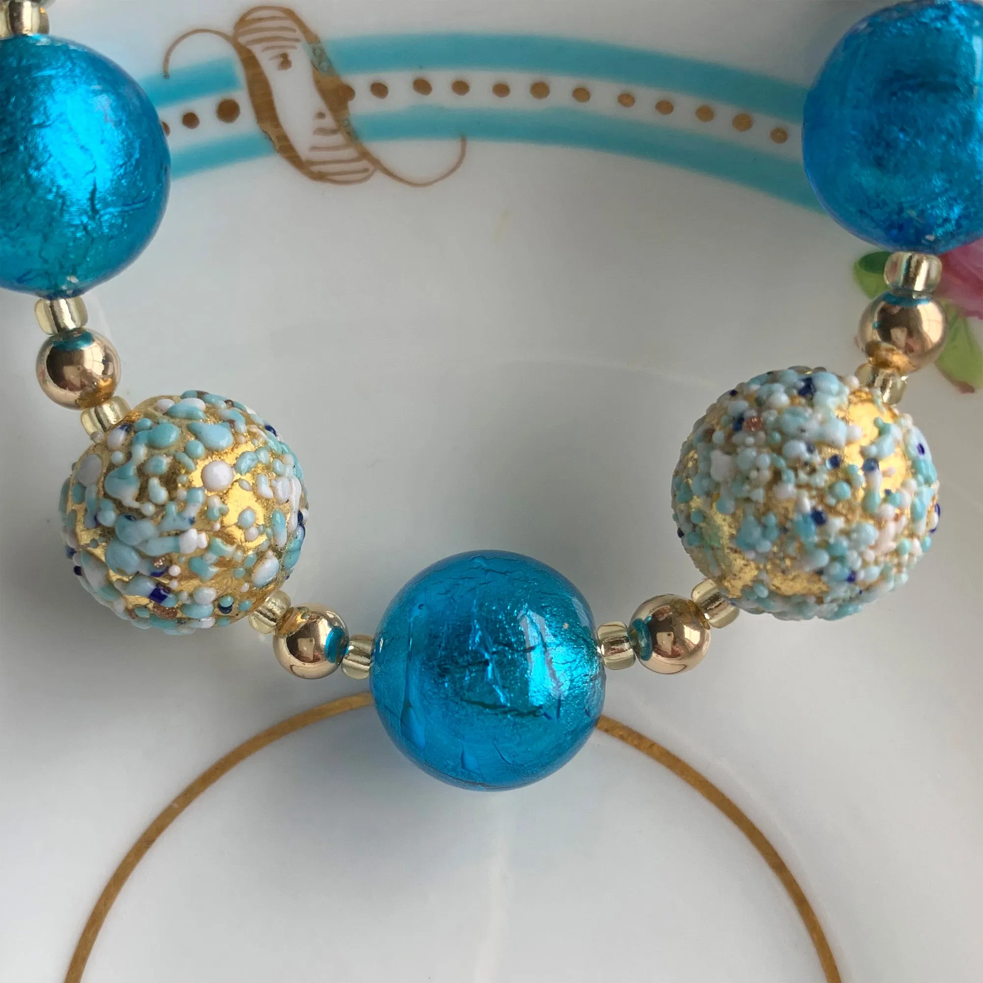 Necklace with speckled blues over gold and turquoise Murano glass sphere beads on gold